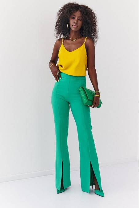 Žalios moteriškos stilingos kelnės